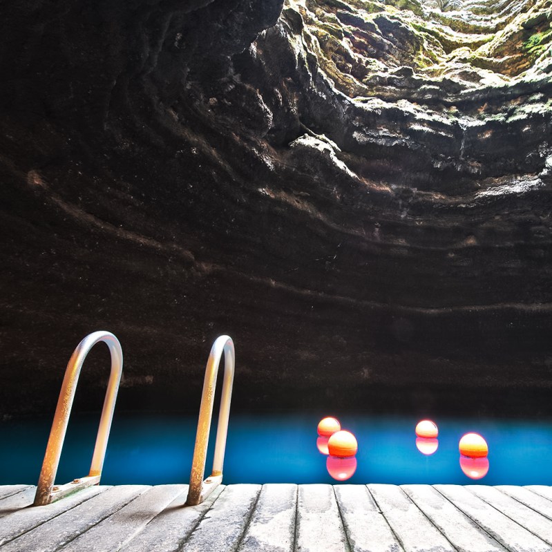 This Geothermal Hot Spring Hides Beneath A Glowing Mineral Dome