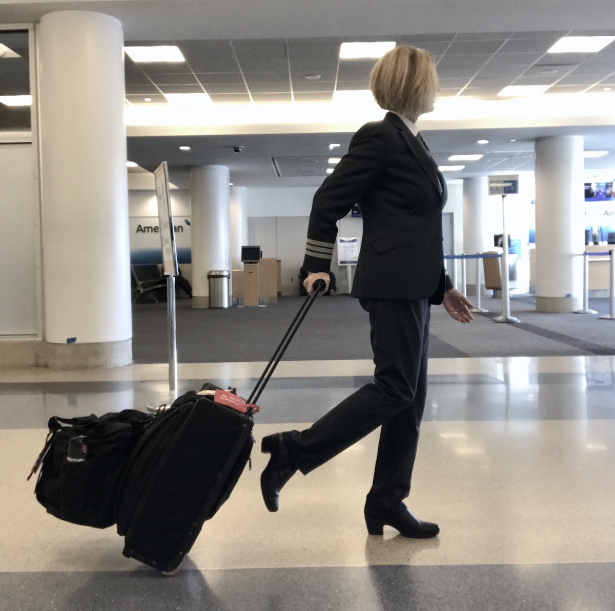 https://www.travelawaits.com/wp-content/uploads/2022/05/Strolling-in-the-airport-with-a-carry-on-and-personal-bag.jpeg?fit=1200%2C1194