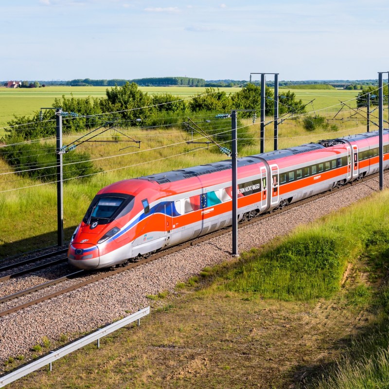 High-speed train operated by Trenitalia in the French countryside